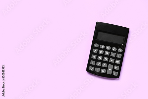 Modern calculator on lilac background