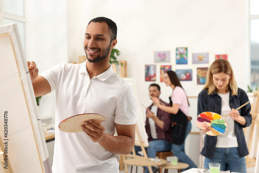 Group of students attending painting class in studio. Creative hobby Group of students attending painting class in studio. Creative hobby
