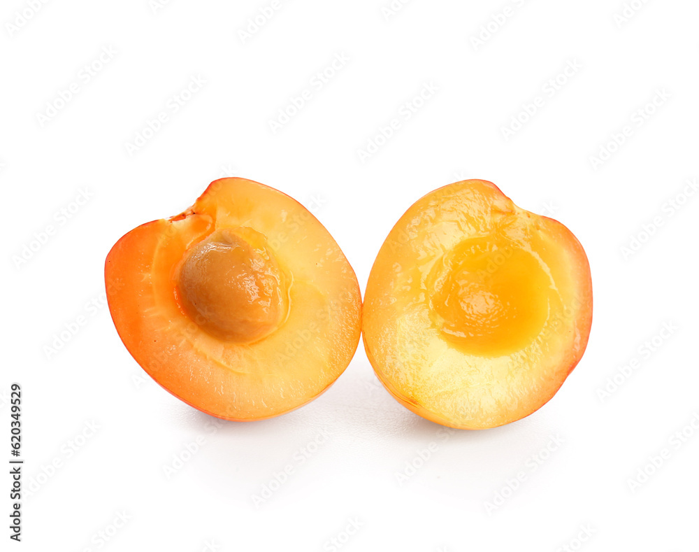 Halves of sweet yellow cherries on white background Halves of sweet yellow cherries on white background