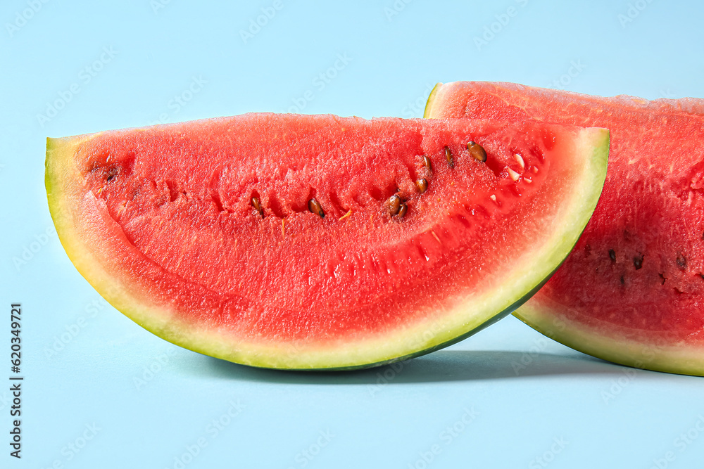 Pieces of fresh watermelon on blue background Pieces of fresh watermelon on blue background