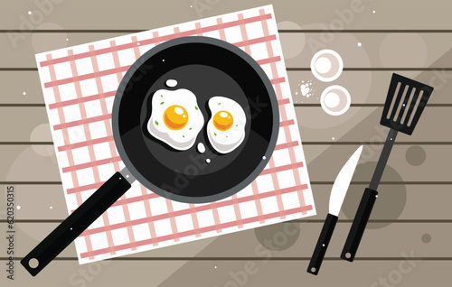 Breakfast with fried eggs in frying pan