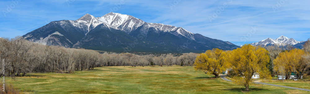 Spring Mountain valley - A panoramic view of a colorful mountain valley at base of snow-capped Mount Princeton on a sunny Spring morning. Colorado, USA.