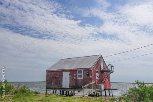 Saxis, Virginia: An old red crab house on the edge of the Pokomoke Sound in the fishing town of Saxis, Virginia.