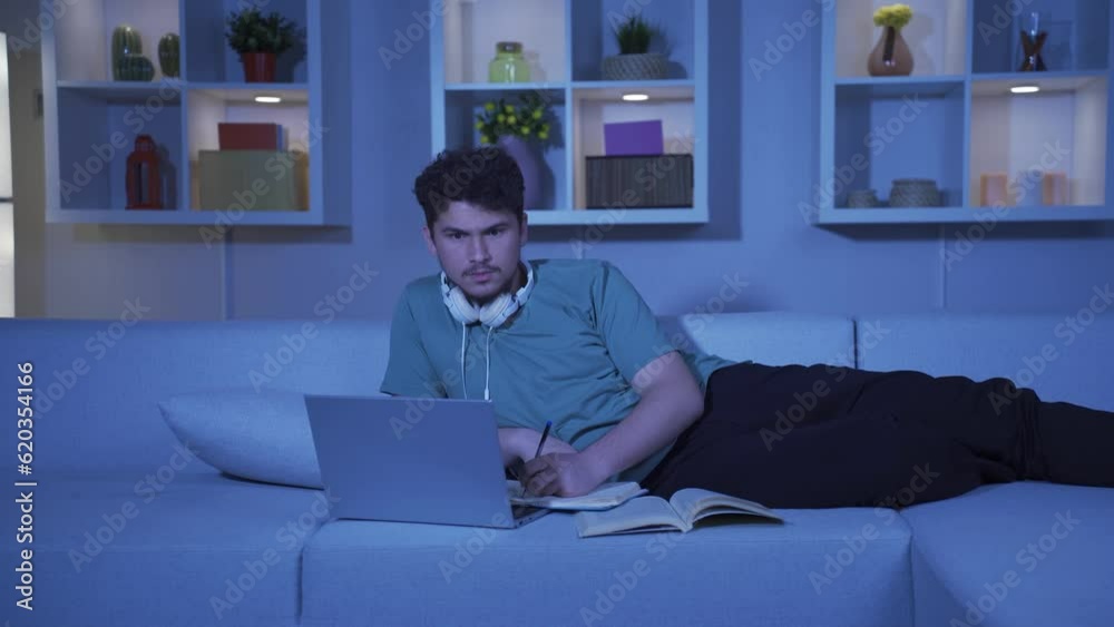 Student looking at laptop in amazement. Student looking at laptop in amazement.