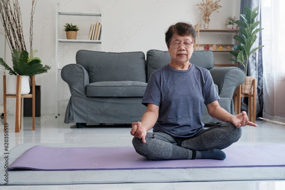 Tranquil Harmony: Senior Woman Discovers Inner Peace through Yoga and Meditation at Home