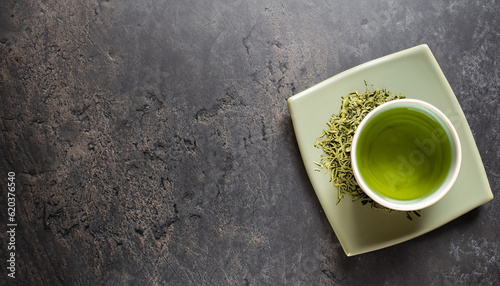 Green japanese tea on stone table. Top view with copy space © Uuganbayar