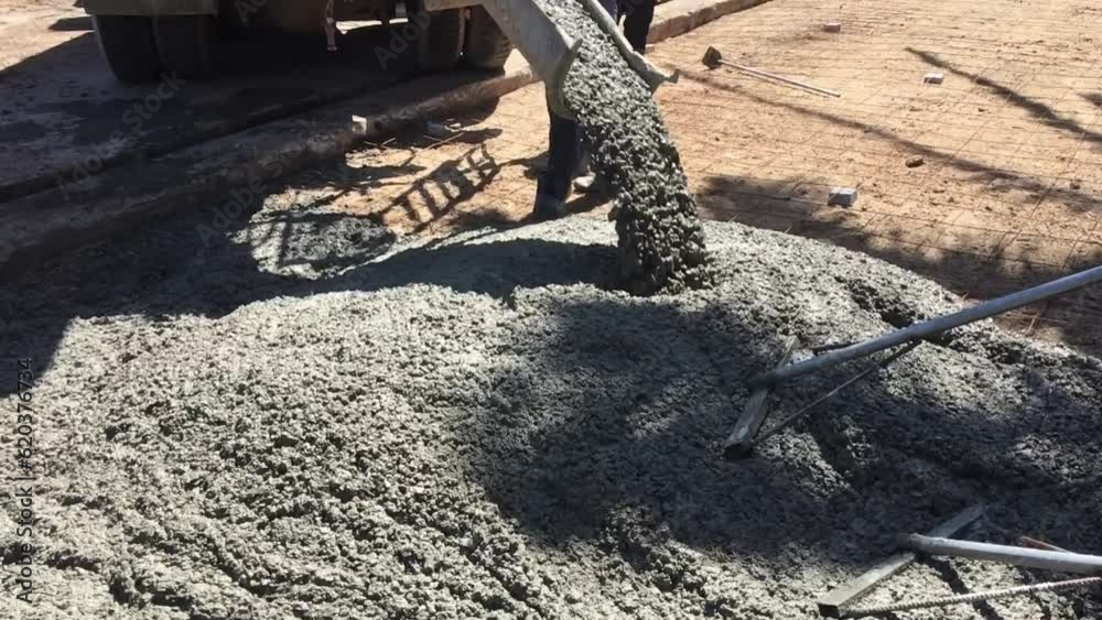 Mixing together to make a strong concrete floor, Mixing concrete concept, Slow motion