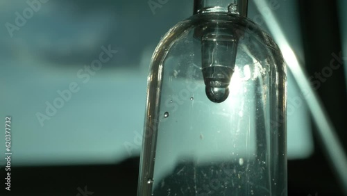 intravenous fluid through IV line in the hospital, 4K slow motion closeup