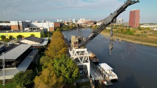 cinematic drone push on Wilmington Delaware riverfront with iconic historic crane dramatic flyover photo