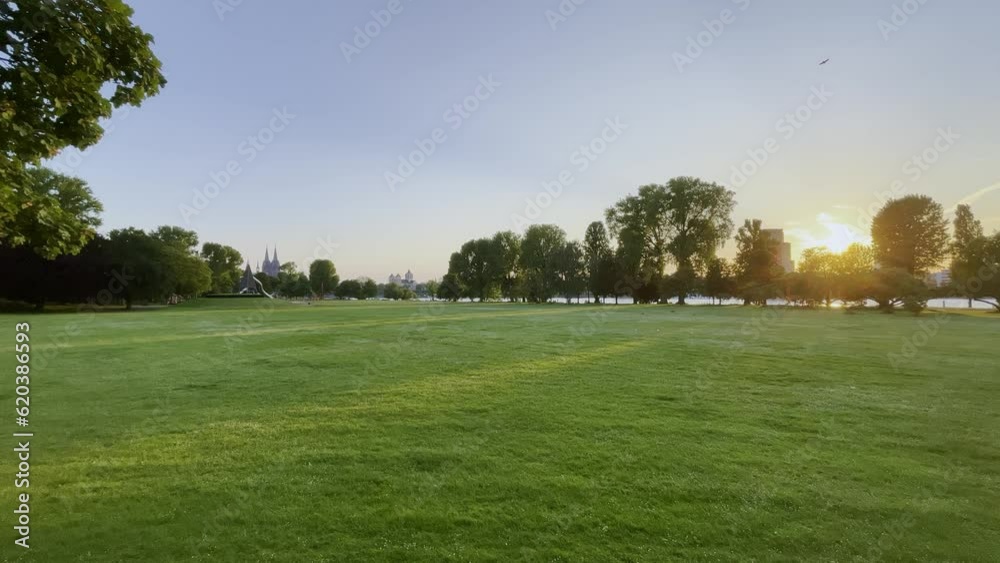 empty meadow of the rheinpark in cologne at sunset with the cathedral in the background in germany empty meadow of the rheinpark in cologne at sunset with the cathedral in the background in germany