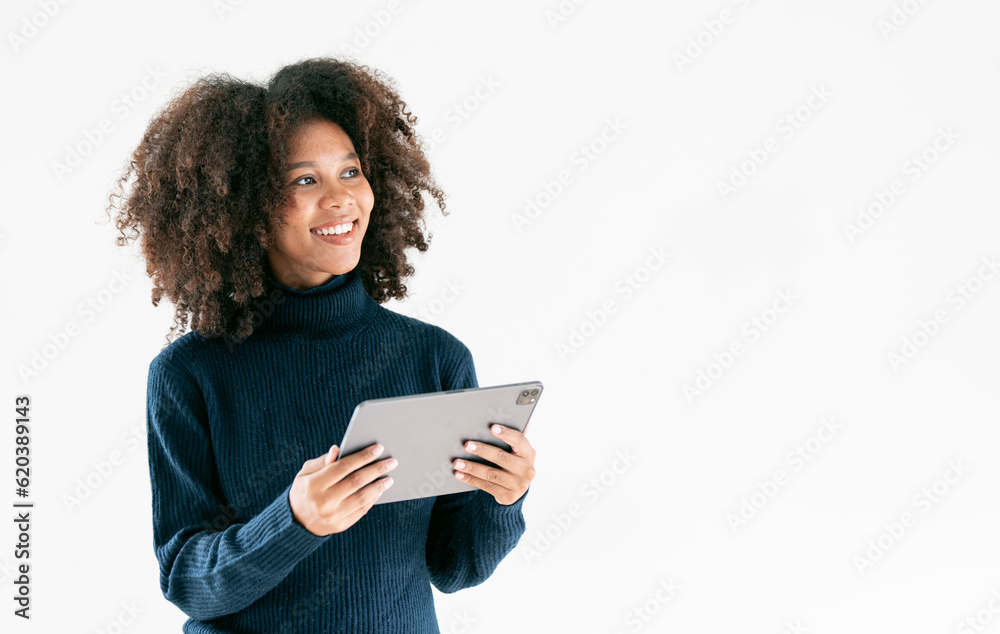 Happy african-american businesswoman using digital tablet over light background, copy space Happy african-american businesswoman using digital tablet over light background, copy space