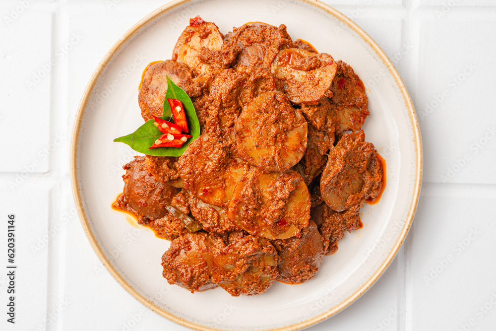 Rendang Jengkol, dogfruit simmered in spices and coconut milk. Indonesian traditional comfort food, with a spicy savory taste typical of rendang and a legit jengkol texture.