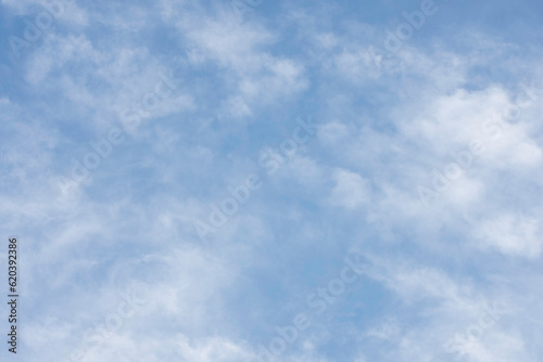 Natural background of diffused clouds against blue sky