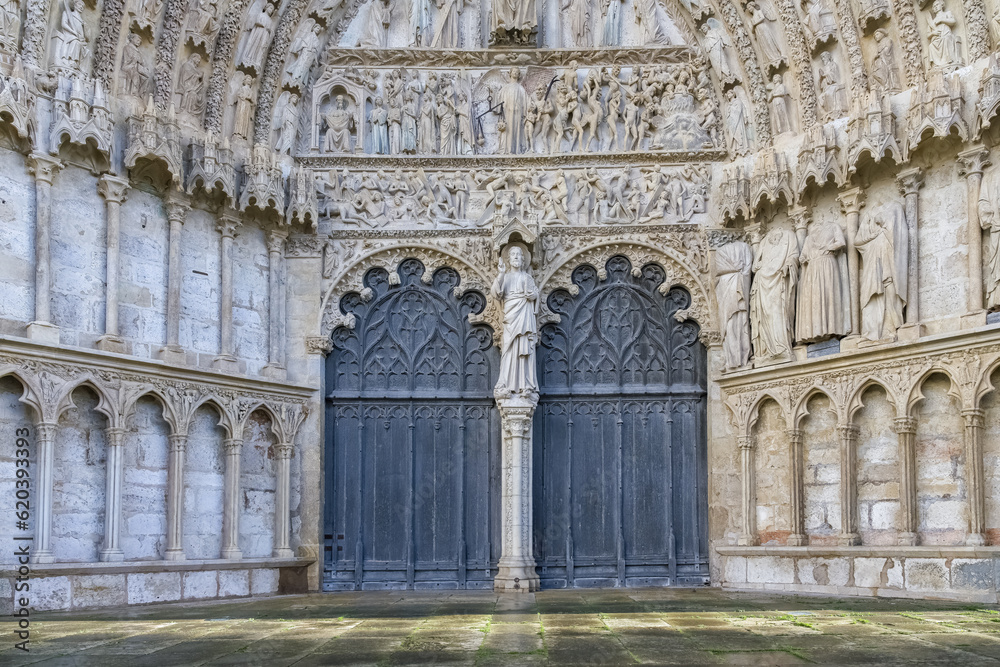 Bourges, medieval city in France, the Saint-Etienne cathedral, main entry with saints statues
