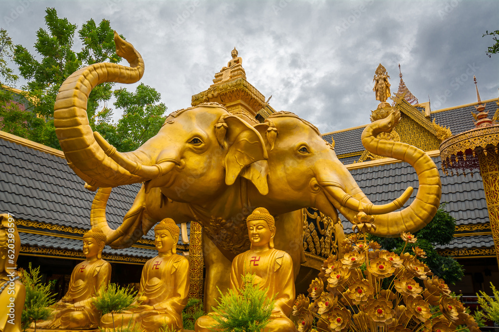 Fototapeta premium The gold three-headed elephant statue has the name Erawan at Wat Mai Supadit Tharam, Nakhon Pathom, Thailand