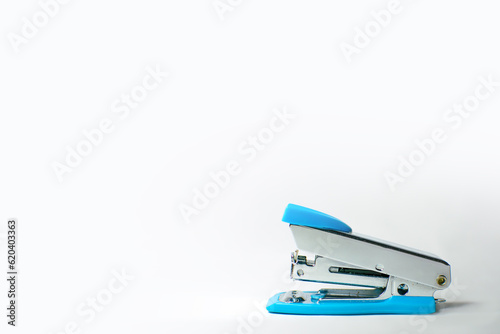 Small Blue office stapler isolated on white background