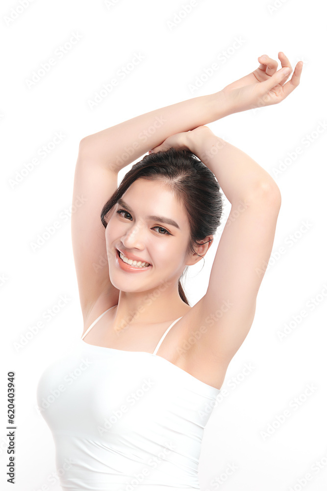 Beautiful Young Asian woman lifting hands up to show off clean and hygienic armpits or underarms on white background, Smooth armpit cleanliness and protection concept Beautiful Young Asian woman lifting hands up to show off clean and hygienic armpits or underarms on white background, Smooth armpit cleanliness and protection concept
