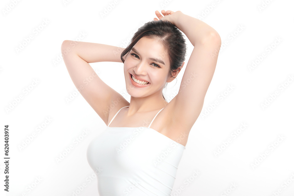 Beautiful Young Asian woman lifting hands up to show off clean and hygienic armpits or underarms on white background, Smooth armpit cleanliness and protection concept Beautiful Young Asian woman lifting hands up to show off clean and hygienic armpits or underarms on white background, Smooth armpit cleanliness and protection concept