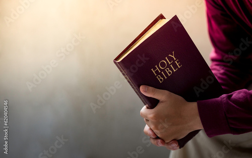 Fototapet Believers are reading the Holy Bible every day and every time in a private room