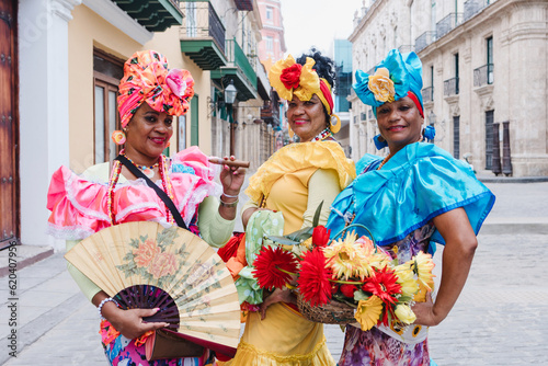 Photography Cuban women called canasteras with habano flowers and typical costume in La Hava