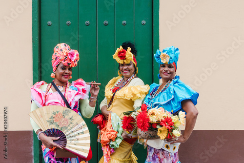 Cuban women called canasteras with habano flowers and typical costume in La Havana, Afro caribbean people in Latin America © Marcos