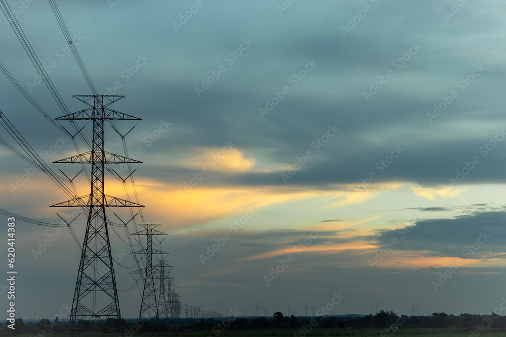 High-voltage pylons supply electricity to areas outside the city. beautiful sky