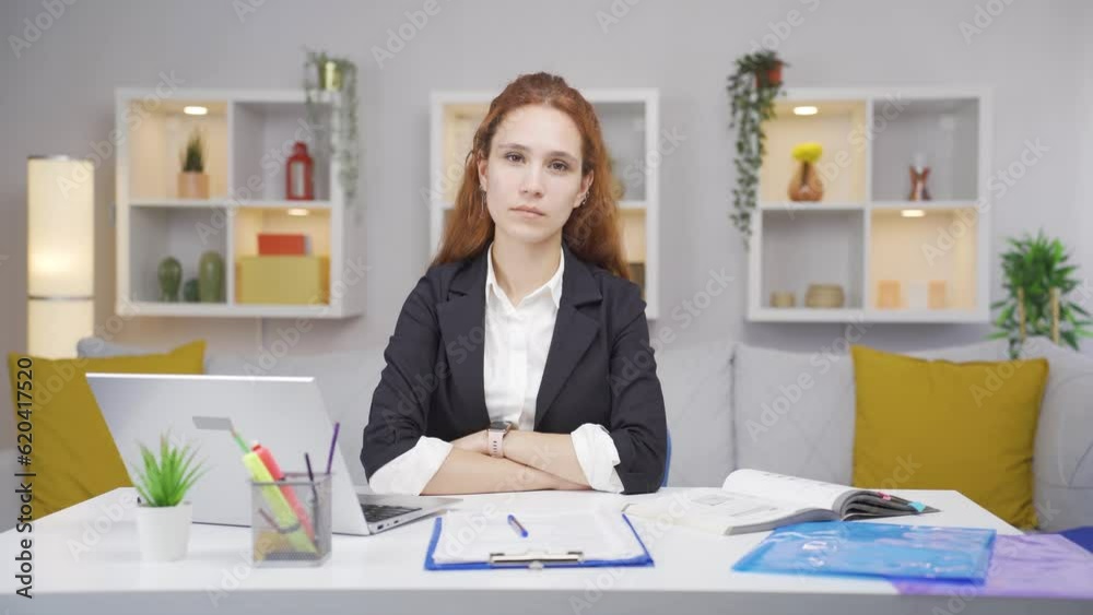 Home office worker woman looking dull at camera. Home office worker woman looking dull at camera.
