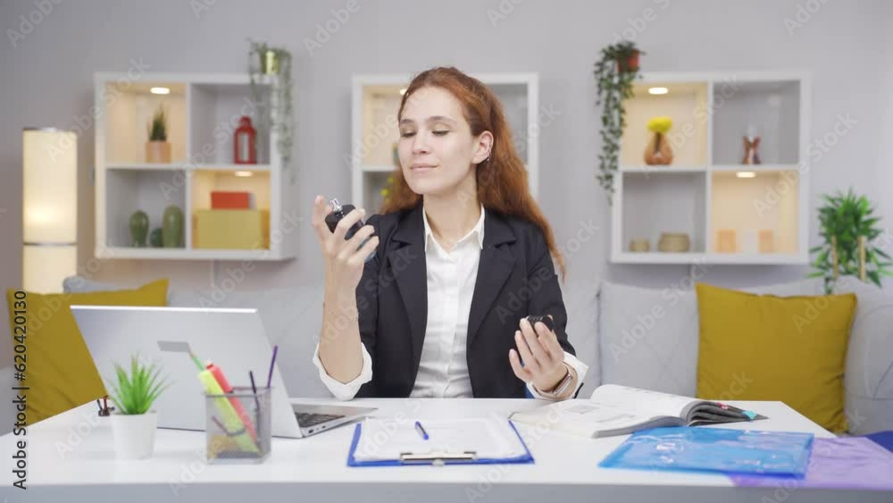 Home office worker sprays perfume on woman. Home office worker sprays perfume on woman.