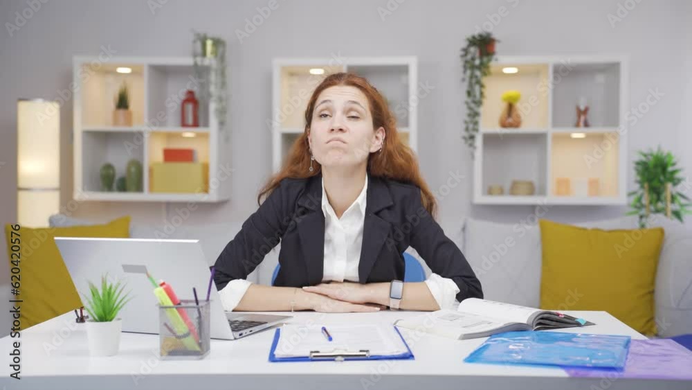 Home office worker woman nods to the camera, says no, no. Home office worker woman nods to the camera, says no, no.