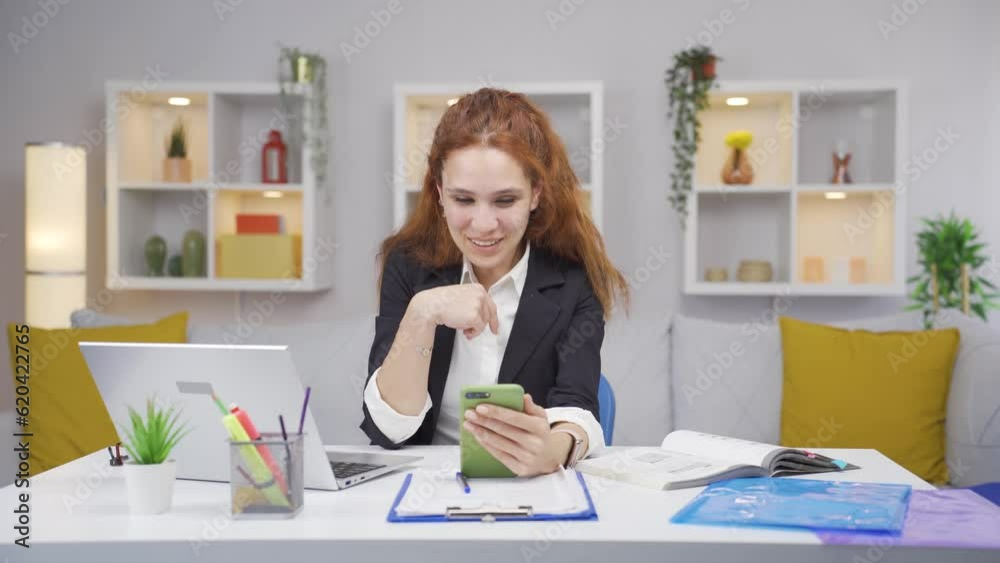 Home office worker woman talking on the phone facetime happily. Home office worker woman talking on the phone facetime happily.
