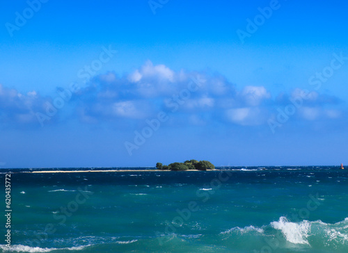 View of Owen island from the shores of Little Cayman, the smallest of the trio of the British Overseas territory of the Cayman Islands photo