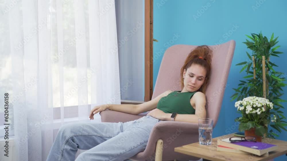 Happy woman lying on the sofa. She is resting. Happy woman lying on the sofa. She is resting.
