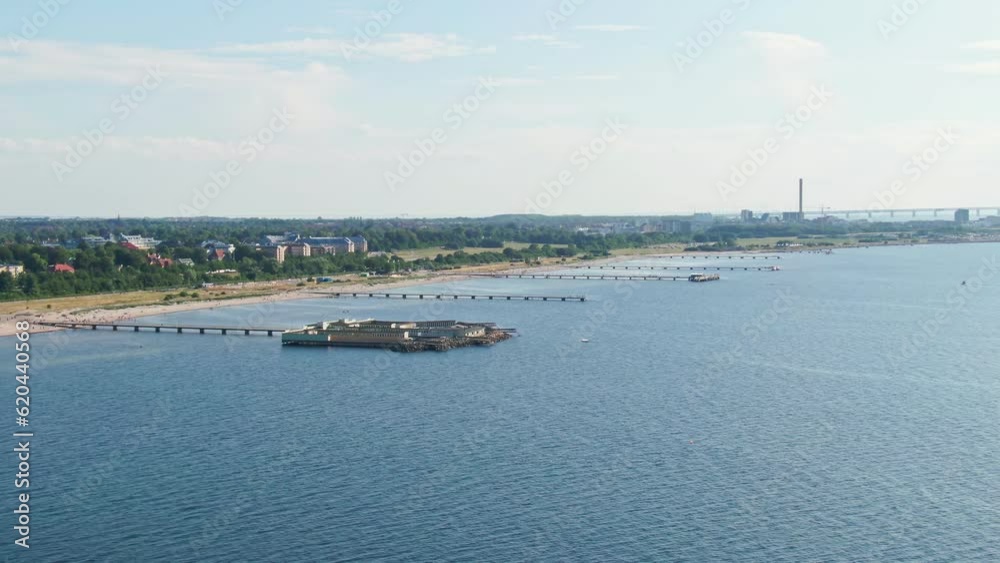 Wide aerial view of Ribersborgsstranden and the open-air bath in Malmö, Sweden. Wide aerial view of Ribersborgsstranden and the open-air bath in Malmö, Sweden.