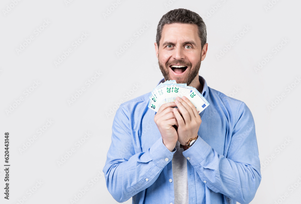 surprised man with salary money isolated on studio background. man with salary money surprised man with salary money isolated on studio background. man with salary money
