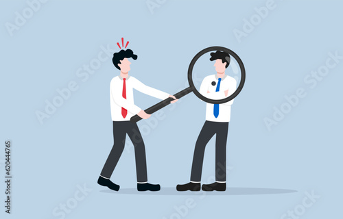 Analyzing competitor in marketing, understanding strength and weakness of competitor to develop effective strategy concept, Businessman seeing black spot on competitor body through magnifier.