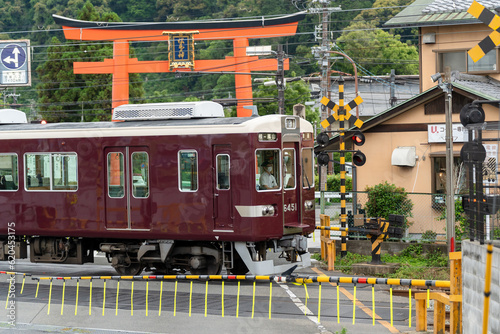 Kyoto, Japan - June 12 2023 : Hankyu Arashiyama Line train on Matsuo-taisha Station. photo