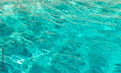 defocused summer pool background. defocused summer pool background with ripples.