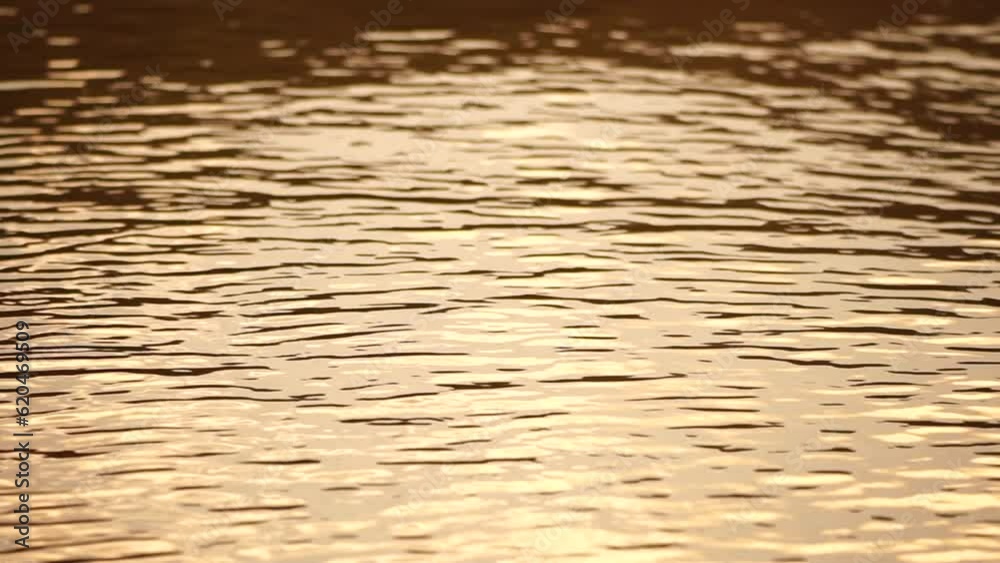 Ripples on water surface with the reflection of sky and clouds. clouds in blue sky reflect on lake, movement of wave on water surface, white fluffy clouds. Holiday, vacation and recreational concept. Ripples on water surface with the reflection of sky and clouds. clouds in blue sky reflect on lake, movement of wave on water surface, white fluffy clouds. Holiday, vacation and recreational concept.