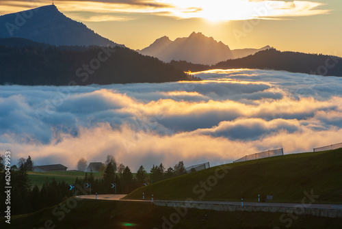 Scenic nature autumn landscape of mountains Pilatus and Rigi on a cloudy day during sunset