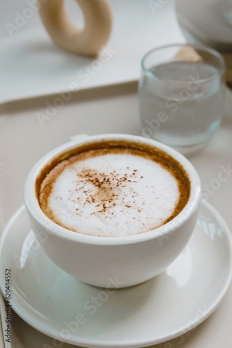 closeup hot cappuccino coffee on white background