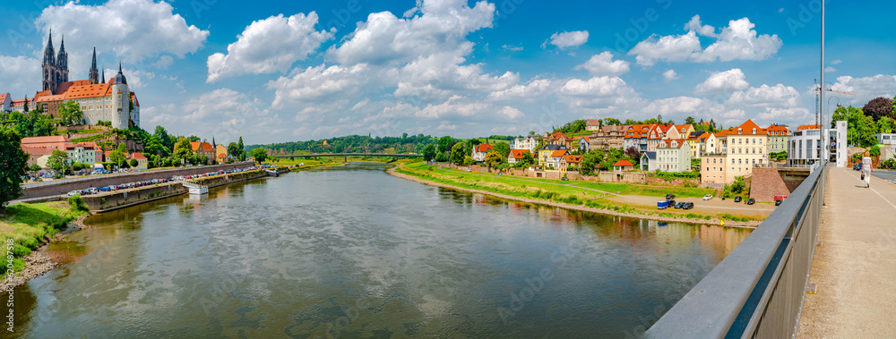 Meissen, Germany - July 4, 2023: Panoramic over famous ancient Meissen Castle, Fortress and Cathedral near Dresden at Elbe river. Sunny summer day with blue sky