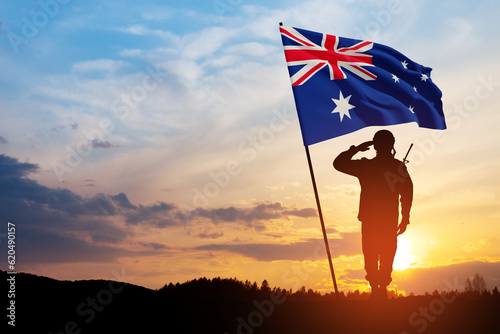 Silhouette of soldier saluting with Australia flag on background of the sunset or the sunrise background. Anzac Day. Remembrance Day. photo