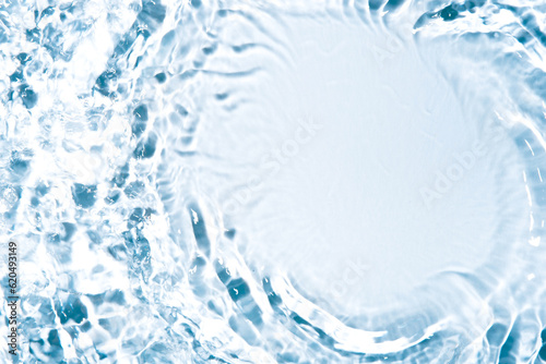 The texture of water on a white background in bright sunlight.