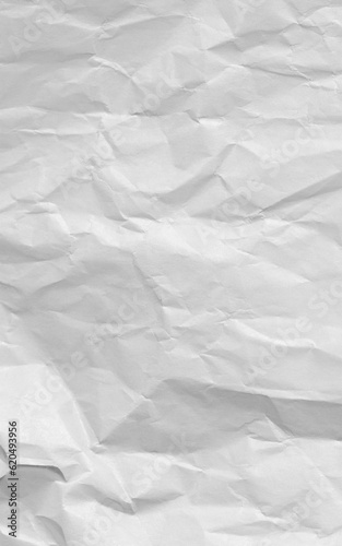 Crushed white paper sheet of notebook or copybook. Blank wrinkled paper for homework and exercises. Torn of white jotter.