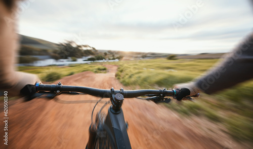 Sports, cycling and person pov on a bike in nature for fitness, training and morning cardio routine. Bicycle, exercise and cyclist riding in countryside with freedom performance or speed challenge photo