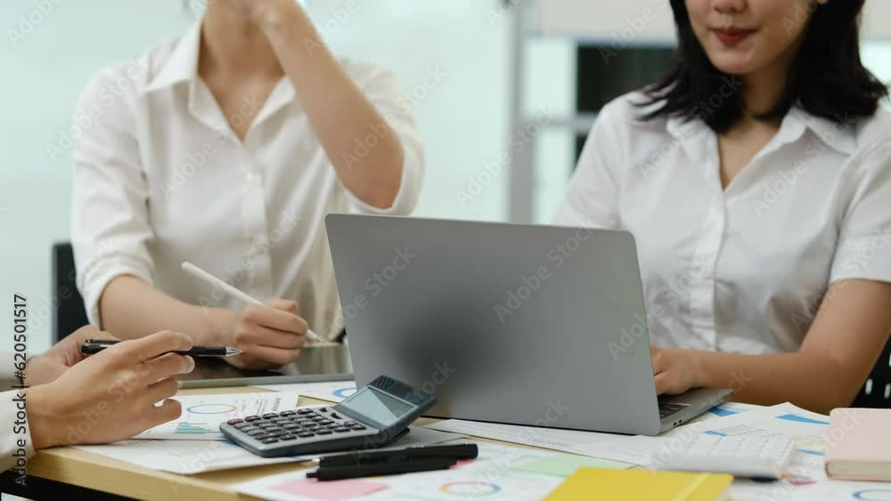 Group of financiers are working on investment and marketing projects together at office Group of financiers are working on investment and marketing projects together at office