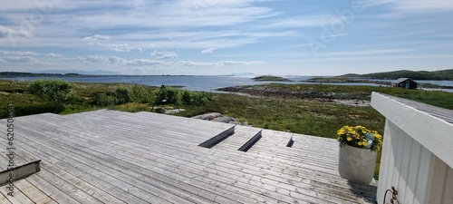 patio and ocean view from cabin in Herøy in Norland municipality photo