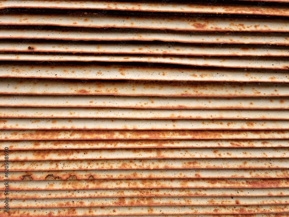 old rusted metal wall section on abandoned building old rusted metal wall section on abandoned building