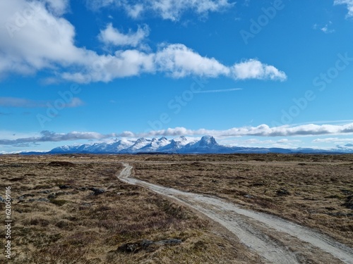 majestic landscape with the famous seven sisters mountain range in the background on a clear summer day in nordland  taken from the Her  y island