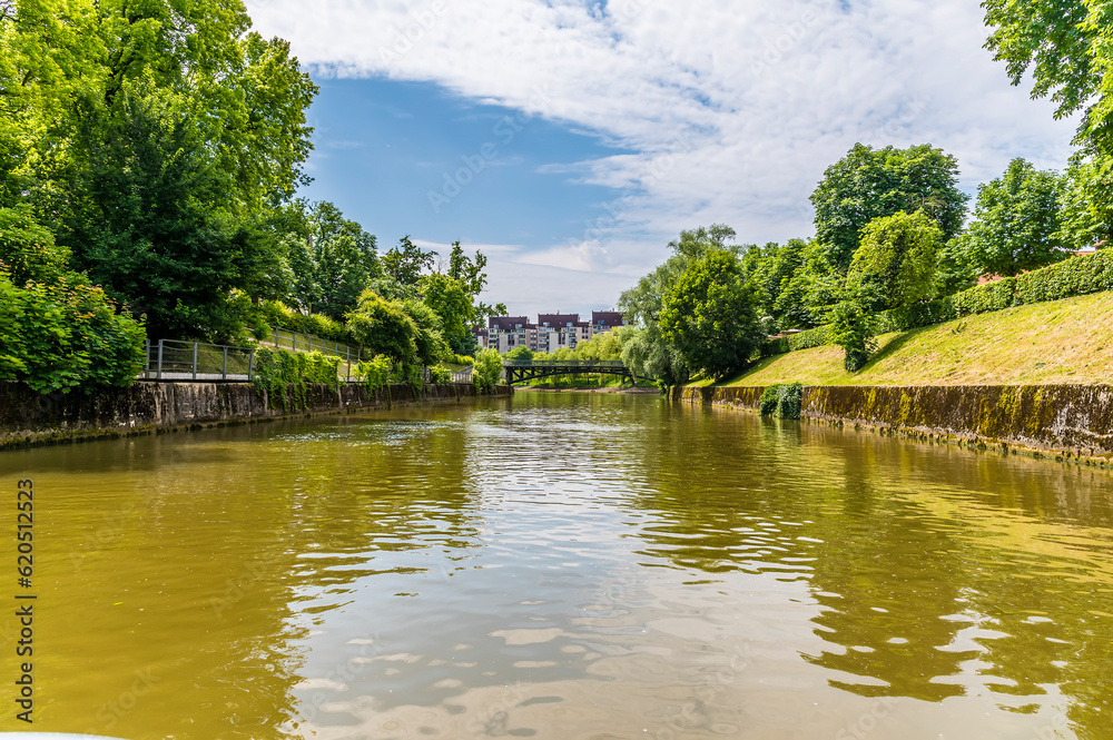 A view up the Ljubljanica River towards the Mortuary Bridge the first and only cast iron, hinged bridge in Slovenia in summertime